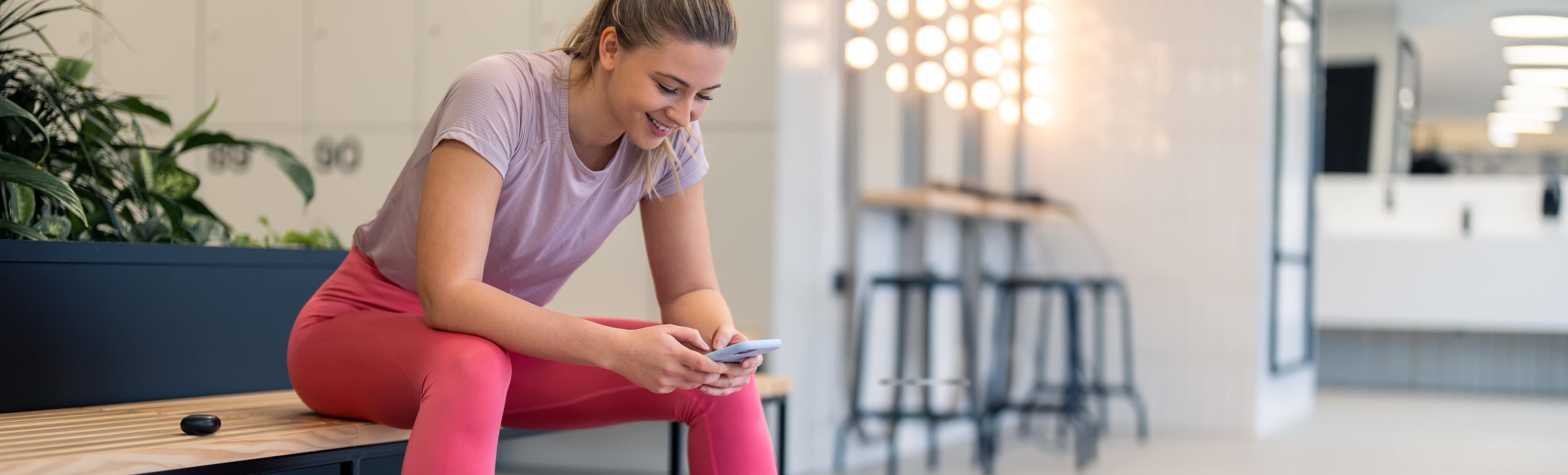 a person in the gym checking their phone