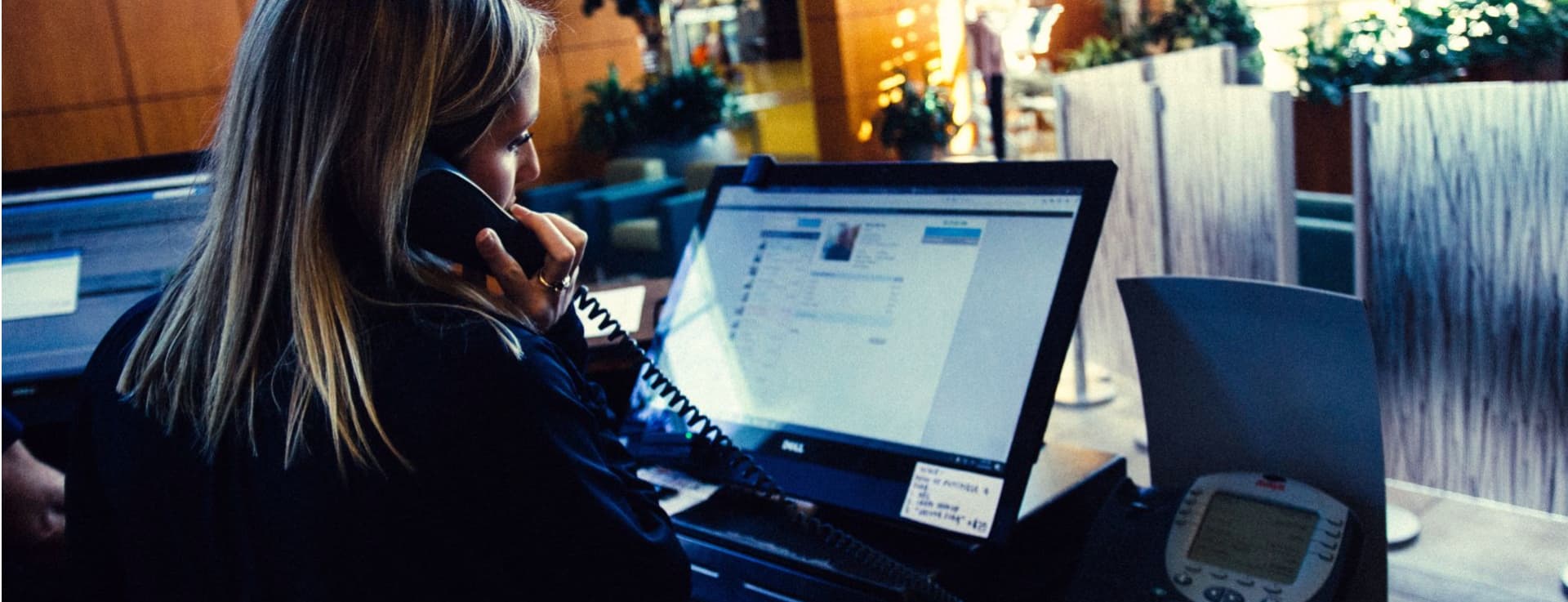 Person working at a fitness club front desk